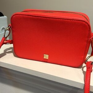 Peachy Red Kate Landry crossbody bag , zipper inside ; pocket outside